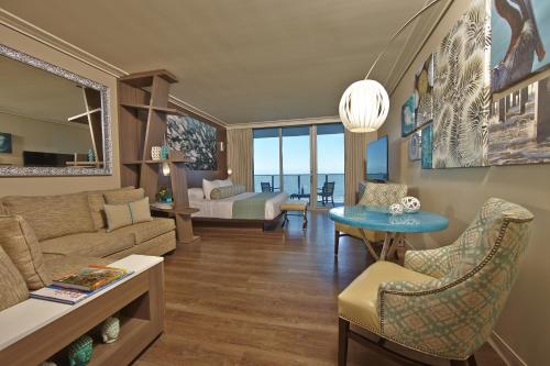 a living room with a couch and a table at Opal Sands in Clearwater Beach