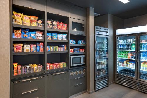 a kitchen filled with lots of food and drinks at Courtyard by Marriott Jackson Madison in Madison