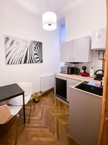 a kitchen with a zebra painting on the wall at Altius Studio 2 in Braşov