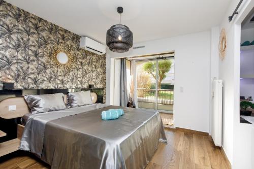 a bedroom with a bed and a large window at Sweet Namaste - Host Provence in Mandelieu-la-Napoule