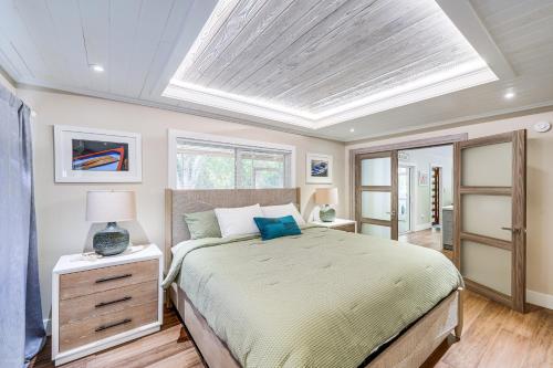 a bedroom with a large bed and a skylight at Walk to Beach Home 8 Mi to Key Largo! in Tavernier