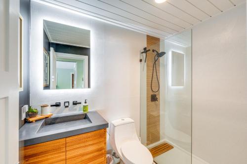 a bathroom with a toilet and a sink and a shower at Walk to Beach Home 8 Mi to Key Largo! in Tavernier