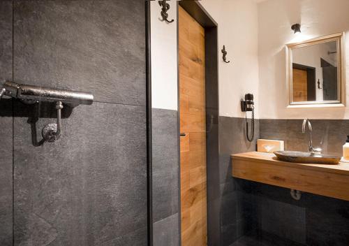 a bathroom with a shower and a sink at Hotel Land Gut Höhne in Mettmann