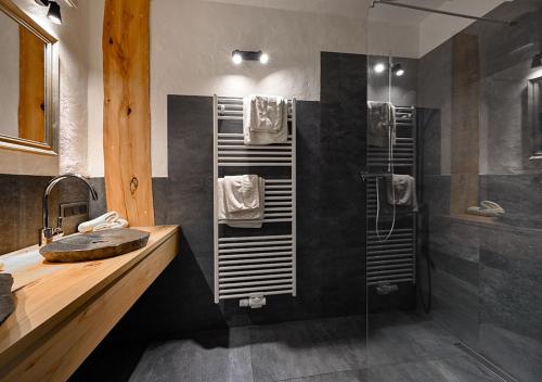 a bathroom with a shower and a sink at Hotel Land Gut Höhne in Mettmann