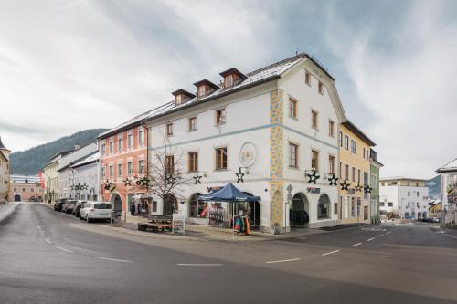 a large white building on the side of a street at Centro 7 - Kristall Lungau in Tamsweg