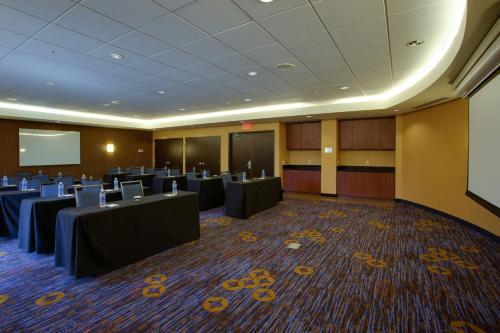 a conference room with tables and chairs in it at Courtyard Republic Airport Long Island/Farmingdale in Farmingdale