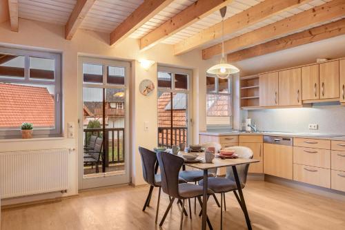 a kitchen with a table and chairs in a room at Ferienhaus Hof Schäfer in Waldeck