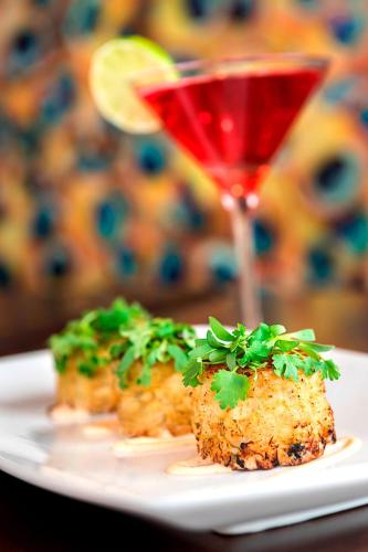 a white plate with food and a glass of wine at Courtyard by Marriott Philadelphia Lansdale in Lansdale