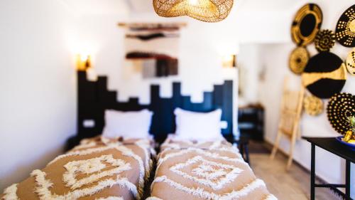 a bedroom with two beds in a room at Dakhla Attitude in Dakhla