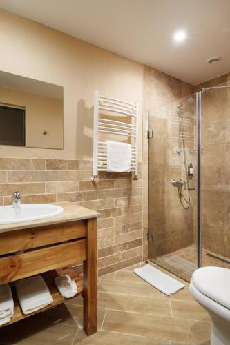 a bathroom with a sink and a shower at Apricot Aghveran Resort in Agveran