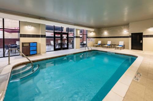 a pool with blue water in a hotel room at Courtyard Winston-Salem Downtown in Winston-Salem
