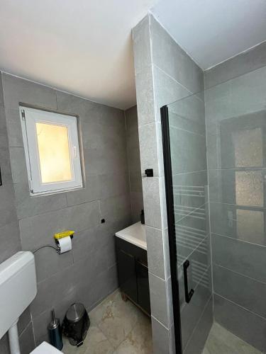 a bathroom with a shower and a sink at COM Home Sovata in Sovata