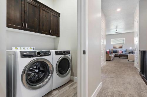 a laundry room with a washer and dryer at 30-31| 2 Homes in St George with Private Pools and Hot Tubs in Santa Clara