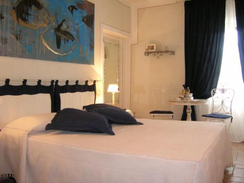 Säng eller sängar i ett rum på B&B Il Moscondoro