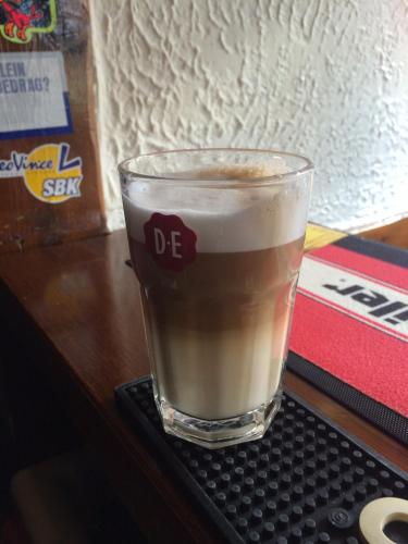 a glass of coffee sitting on top of a keyboard at HCR De Tukker in Westdorpe