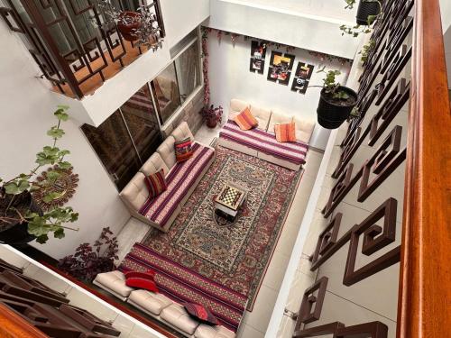 an overhead view of a living room with a rug at Hotel Valle Andino in Cusco
