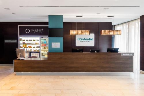 a store with a checkout counter in a lobby at Occidental Praha Five in Prague