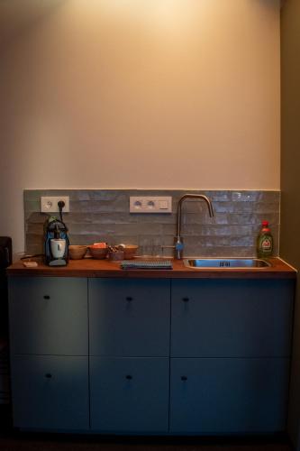 a kitchen with a sink and a counter top at Studio Kittel Guest Room with Private Bathroom in Bruges