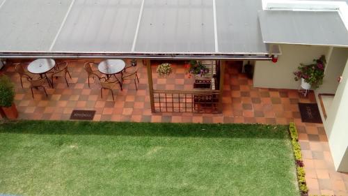 an overhead view of a patio with tables and chairs at Hotel Sumaq Kay in Cumbayá