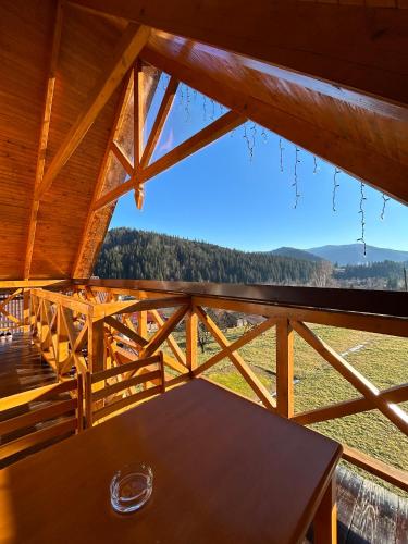 a view from the roof of a cabin with a table at Eco Sadyba Chertizh in Tatariv
