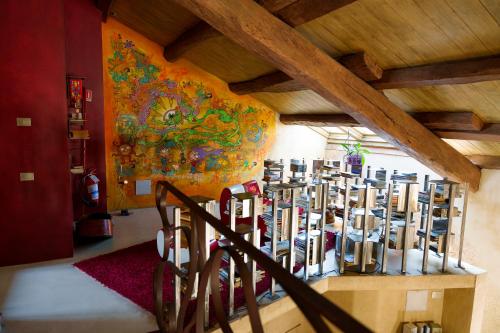 a room with a bunch of wine bottles on a wall at Casa Baladin camere di Charme e Agronidi dell'Open Garden in Piozzo