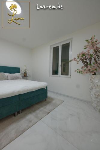 Ένα ή περισσότερα κρεβάτια σε δωμάτιο στο Luxrem Apartments 4