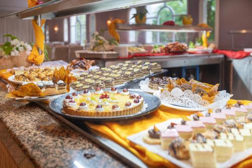 a buffet line with many different desserts and pies at Djerba Resort- Families and Couples Only in Houmt Souk