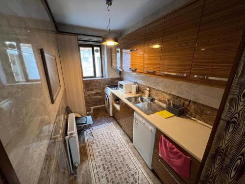 a small kitchen with a sink and a counter at Taksim Sofa House in Istanbul