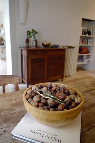 a bowl of nuts sitting on top of a table at La Grande Maison de Migou in Larrazet