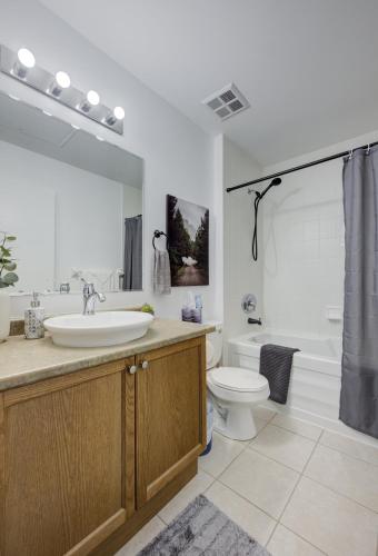 a bathroom with a sink and a toilet at Entire 1 bedroom in the heart of KW downtown across Google in Kitchener
