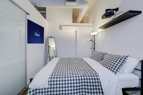 a bedroom with a black and white checkered bed at Entire 1 bedroom in the heart of KW downtown across Google in Kitchener