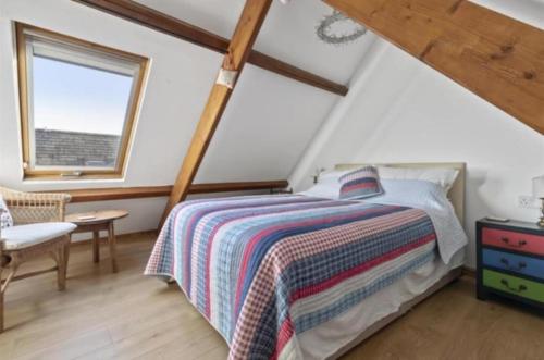 En eller flere senge i et værelse på Park Court Barn