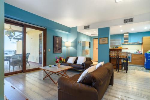 a living room with a couch and a table at DHOME Baia Mazzaro' in Taormina