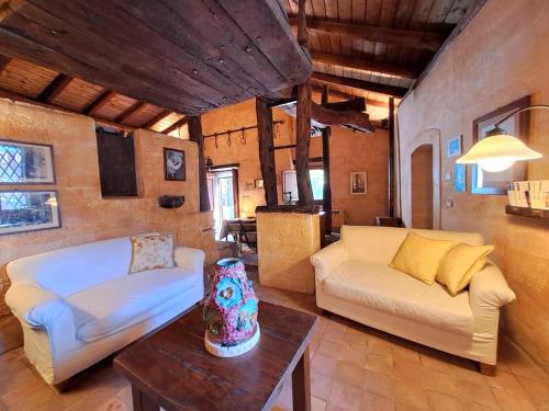 a living room with a couch and a table at Dimora Migliori in Viagrande