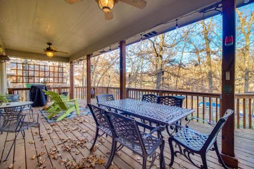 a patio with a table and chairs on a deck at Lakefront Home with Furnished Deck in Grove! in Grove