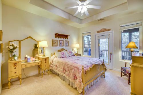 a bedroom with a bed and a dresser and a mirror at Lakefront Home with Furnished Deck in Grove! in Grove