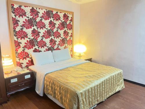 Ένα ή περισσότερα κρεβάτια σε δωμάτιο στο Garden Business Hotel