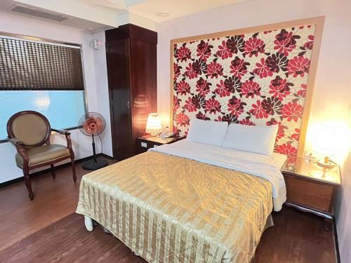 Ένα ή περισσότερα κρεβάτια σε δωμάτιο στο Garden Business Hotel