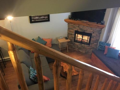 a view of a living room with a fireplace at BigWhite Ski In-Out Chalet w Priv HotTub & Garage in Big White