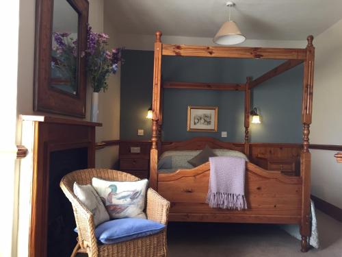 A bed or beds in a room at The Bull Inn West Tanfield