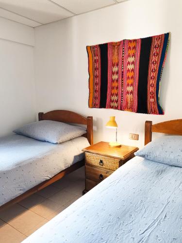 Ένα ή περισσότερα κρεβάτια σε δωμάτιο στο Hostal Margaritas - Torotoro