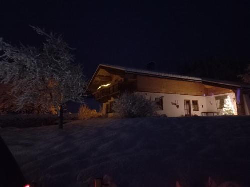 a house at night with the lights on at Chalet Glücklich sein... in Ellmau