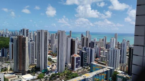 an aerial view of a city with tall buildings at Beach Class Convention - Flats em Boa Viagem por Yolo in Recife