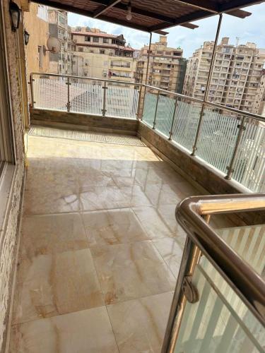 an empty balcony with a view of a city at دوبليكس فاخر فيلا للايجار مفروش في ارقي اماكن لوران in Alexandria