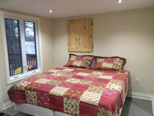Кровать или кровати в номере Victoria Harbour Cottages
