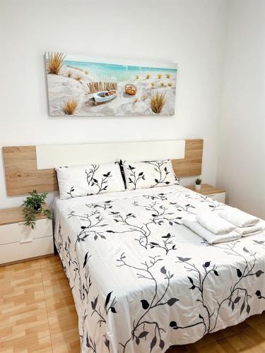 Ένα ή περισσότερα κρεβάτια σε δωμάτιο στο Apartamento Poseidon