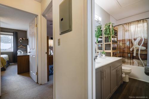 a bathroom with a sink and a toilet at Entire Lovely Townhouse Mountain View! in Canmore