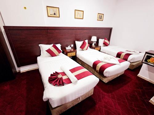 Postel nebo postele na pokoji v ubytování Ajyal Al Madina Hotel 3