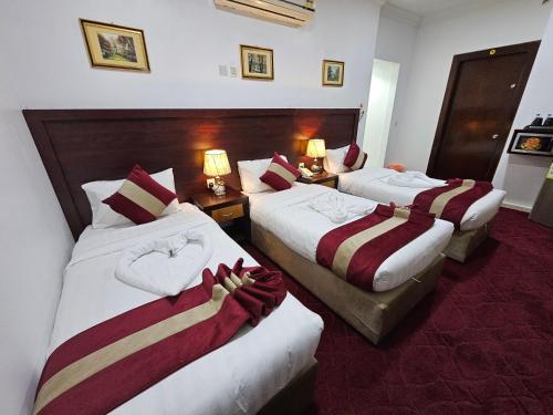 Postel nebo postele na pokoji v ubytování Ajyal Al Madina Hotel 3