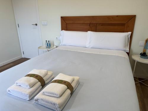 Postel nebo postele na pokoji v ubytování B&Suites Xàtiva